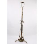 An Edwardian brass telescopic standard lamp with scroll support,