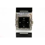 A lady's Omega Constellation wristwatch, with diamond set black dial and diamond bezel, case
