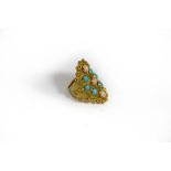 An Italian 18k gold, coral and turquoise ring, the lozenge shaped plaque set with three coral