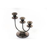 A modern silver three-branch candlestick, Birmingham 2000, on a circular foot, weighted,