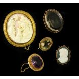 A Victorian shell cameo oval brooch depicting a religious scene, in a yellow metal frame, 6.5cm x 5.