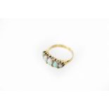 An opal five-stone ring, the row of five graduated oval opals with diamond chips to the corners,