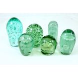 Six green glass dumps, the largest 14.