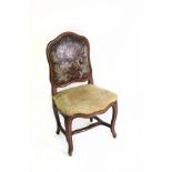 A Continental walnut framed chair with leather panel back,