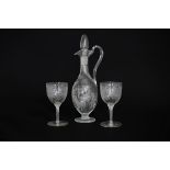 A Victorian etched glass ewer and two matching glasses CONDITION REPORT: Small chip