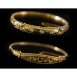 A 15ct yellow gold hinged bangle, circa 1912, set with three diamonds,