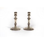 A pair of 18th Century style cast silver candlesticks, CJ Vander, London 1977/1979, of knopped form,