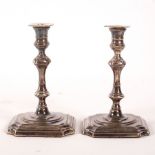 A pair of Queen Anne style silver taper sticks, George Unite, Birmingham 1904, 10.