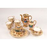 A Paris porcelain coffee pot, milk jug and sugar bowl, circa 1830,
