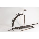 A Spanish boot scraper of unusual form, a long wrought iron poker,