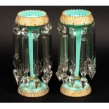 A pair of turquoise and gilt glass table lustres hung with prismatic drops,