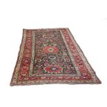 A Karabagh long rug or Khelleh, South Caucasus, circa 1900, consistent wear,