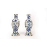 A pair of late 18th Century Delft vases, decorated birds among branches, marked 16 beneath,