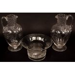 A pair of glass ewers, 21cm high and a bowl, 16.