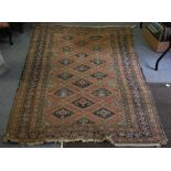A Caucasian rug with central field of seventeen medallions within a stylised multi figured border,