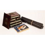 A Chinese mahjong set, cased in rosewood with brass carry handles, 23.