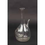 An English glass ice pocket decanter, the globular body with a side pocket,