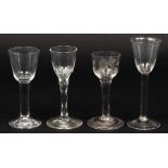 Three 18th Century wine glasses of plain straight stems,