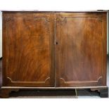 A 19th Century mahogany side cabinet enclosed by panel doors on bracket feet, 125.