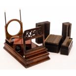 A Victorian walnut cased stereoscopic viewer and two boxes of slides modelled as books,