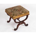 A Regency style X-framed carved stool,
