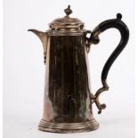 A Queen Anne style silver coffee pot, London 1937, of plain tapering form with ebonised handle,