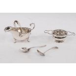 A silver tea strainer and stand, Mappin & Webb, Birmingham 1944, a sauce boat,