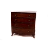 An early 19th Century mahogany bowfront chest fitted four long drawers on splay feet,