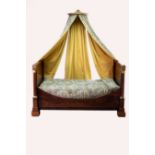 An Empire mahogany lit bateau with gilt metal mounts, coronet and fabric canopy,