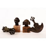 Two small Tibetan bronze heads,