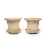 A large pair of campana shaped urns, the flanged tops with egg and dart borders,