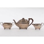 A three-piece silver tea set, JD & S, Sheffield 1932/33, of canted rectangular form on scroll feet,