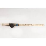 A Chinese bone opium pipe with enamelled mounts and decorated with figures and foliage,