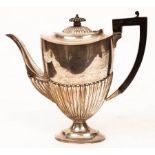 A silver coffee pot, Sheffield 1919, of oval half-ribbed form, 24cm high,
