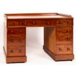 A mahogany pedestal desk with galleried top,