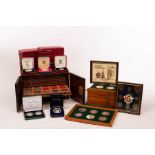 Two coin collector's cabinets and a variety of proof coins