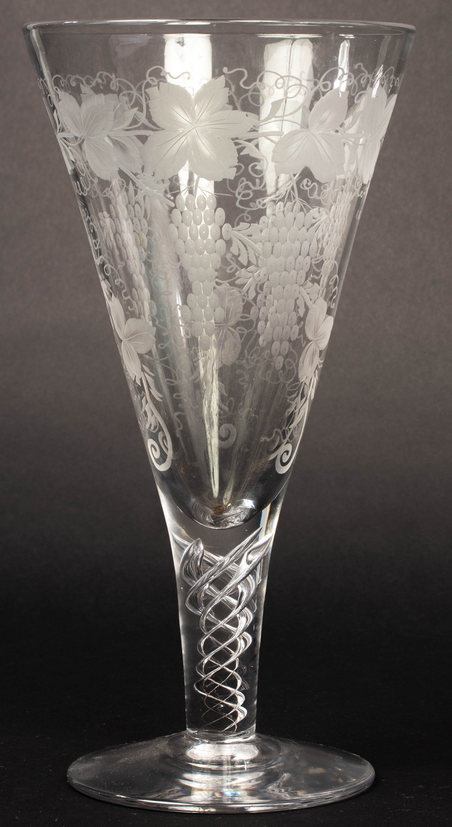 A large glass etched with grapes and vines on an air twist stem, - Image 2 of 4