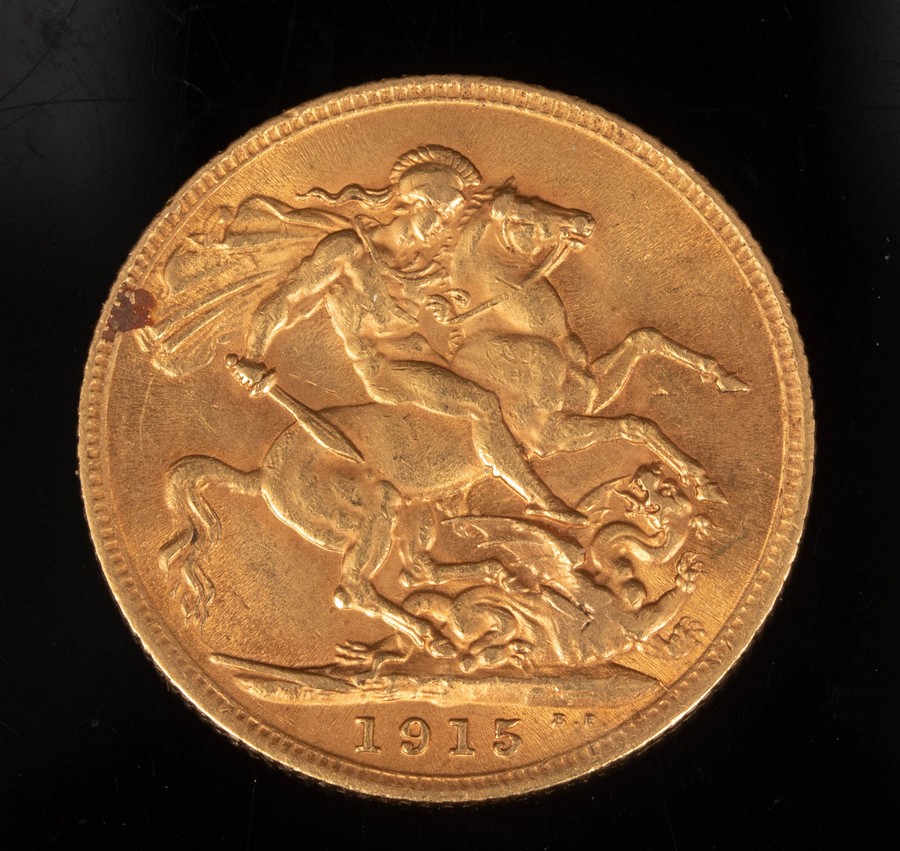 A George V gold sovereign,