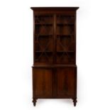A mahogany bookcase enclosed by a pair of astragal glazed doors with cupboard under, on turned feet,