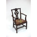 A George III open armchair with splat back,