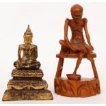 A South East Asian carved and gilded figure of Buddha, 22cm high and a carving of a luohan, 27.