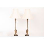 A pair of Empire style table lamps with vase-shaped supports, complete with shades,