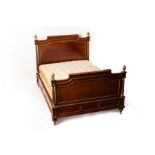 A Louis XIV gilt metal mounted double bed, the posts with pine cone finials,