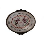 A late 19th Century French oval patch box, the lid painted with love birds and motto,