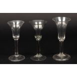 Two 18th Century wine glasses with trumpet bowls on tear included stems and another with plain stem,
