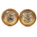 A pair of late 19th Century Continental ceramic plaques, one depicting St George and the Dragon,