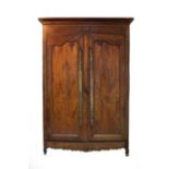 A 19th Century chestnut armoire with moulded cornice above shaped panel doors, 159cm wide,