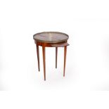 A French marble top mahogany table with brass gallery surround, fitted slides to the sides,
