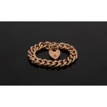 A 9ct rose gold hollow curb link bracelet, with heart-shaped padlock clasp, approximately 24.