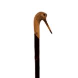 A walking stick with woodcock terminal, hand carved by Ian James,